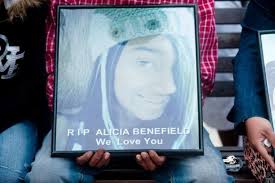 Family, friends remember slain teen at candlelight vigil