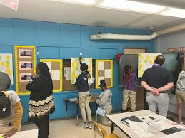 Principal Johnson and ED Tim Smith were invited to Ms. Jessi's Humanities  classroom to participate in a Chalk talk that 6th grade are doing to  prepare for their field study to Gettysburg. #