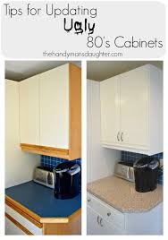 Tips For Updating Melamine Cabinets With Oak Trim Melamine Cabinets Kitchen Cabinets Kitchen Cabinets Makeover
