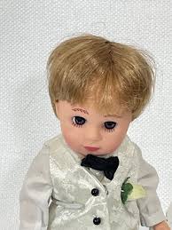 Madame Alexander 8 Ring Bearer doll with stand.