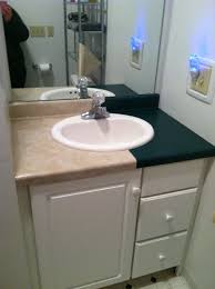 My Bathroom Countertop Covered With Contact Paper From The Dollar Store Wow It Lo Bathroom Countertops Diy Countertop Covers Diy Kitchen Cabinets Makeover