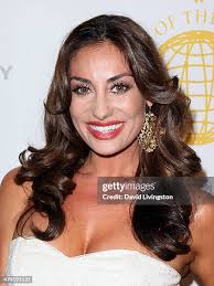 Burcu Unsal wears a dress by designer Andre Soriano at the Queen of... News  Photo