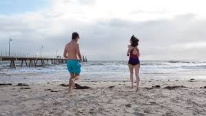 Adelaide fundraisers take a cold plunge at Glenelg to raise money for the  homeless
