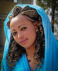 Young Ethiopian Woman Wearing Traditional Dress And Hairstyle Ethiopian Women Ethiopian Hair Beauty