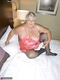 Horny old Grandma Libby strips satin lingerie to fill face & pussy.. at XXX  Granny .me