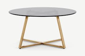 While choosing a coffee table may feel like both an overwhelming and an unsexy task, there are things to consider — beyond your overall aesthetic — to make the process a little less daunting. Haku Coffee Table Brass And Smoked Glass Made Com