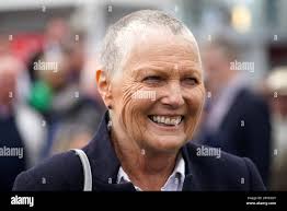 Trainer Jessica Harrington celebrates after seeing horse Lan Cinnte ridden  by jockey Shane Foley win the Download the Tote App Handicap during day  three of the Galway Races Summer Festival at Galway