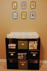 For A Cheaper Practical Change Table We Used A Cube Storage Baby Storage Baby Room Storage Nursery Baby Room