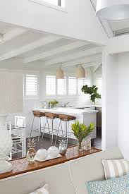 Tropical White Kitchen Sweet Lovely Home Cottage Style Interiors Beach House Kitchens Beach House Decor Tropic woman on the veranda. beach house kitchens