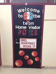 The door decoration is topped with an arching welcome banner, detailed with a pink butterfly, to finish this inviting design. Basketball Theme Door For Our School Sport Theme Sports Theme Classroom Basketball Classroom School Sports Theme