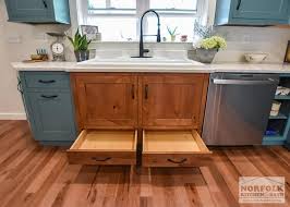 Home to any budget, home to any possibility. Teal Farmhouse Kitchen With Wood Accents Norfolk Kitchen Bath