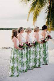 50 Brilliant Beach Wedding Ideas To Embrace Amaze Paperie Printed Bridesmaid Dresses Wedding Bridesmaid Dresses Hawaiian Wedding Themes