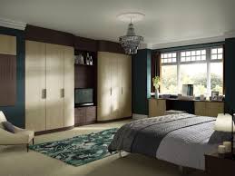 Check out an architect's guide to some inspiring ways to build in extra cabinets, shelves and cubbyholes at the start of a project. Fitted Wardrobes With Tv Space Bedroom False Ceiling Design Fitted Wardrobes Bedroom Bedroom Wardrobe