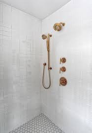 Frameless sliding shower door in brushed stainless steel: White Subway Tile Shower With Brass Hardware Mid Century Badezimmer New York Von Kraftmaster Renovations