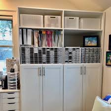 Sewing supplies fit neatly behind cabinet doors, and paper tools tuck away securely into a drawer space keeping everything organized. An Organized Craft Room Is The Best Kind Of Craft Room Positively Jane