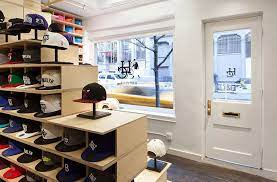 Up A Hat Store Designed With Architecture That Adapts Daily Store Design Hat Stores Design