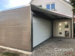 Carport Bauhaus Doppel Rhombo Mit Abstellraum Hausturuberdachung Dreieck Und Einen Sektionaltor Hausturuberdachung Uberdachungen Carport