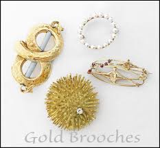 gold brooches and pins