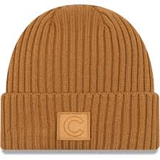 The addition of the pom on top make. New Era Chicago Cubs Tan Label Cuffed Knit Hat