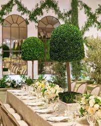 This Mediterranean Inspired Wedding Took Place In A Surprising Location Topiary Wedding Tall Centerpieces Tall Wedding Centerpieces