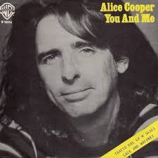 On this day in 1977, the Alice Cooper single “You and Me” peaked at #9