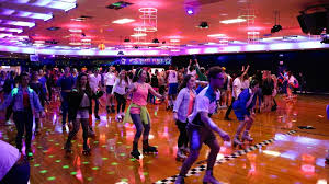 Roller skating rink in the 80s with ...