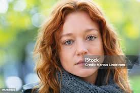 Portrait Of A Woman In A Park Stock Photo