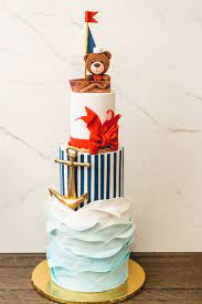 Maybe you would like to learn more about one of these? Three Tier Nautical Themed Birthday Cake Featuring Sugar Waves Gold Edible Anchor And Edible Teddy Bear In Sail Boat Party Cakes Themed Birthday Cakes Cake