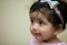 An older man and a young girl in a hospital bed photo