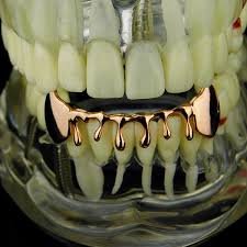 The bridge can be made in 10k, 14k or 18k solid rose gold and features a two tooth design with an overlay connecting over the remaining bottom teeth in between. Best Grillz 14k Rose Gold Plated Drip Fang Grillz Dripping Bottom Vampire Teeth Fangs Grill Hip Hop Mouth Grills Walmart Com Walmart Com
