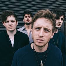 Who produced “Never Say Die” by Skinny Living?