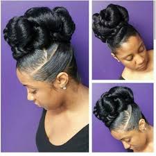 This loosely braided updo features a large braid with a messy style at the bottom of the hair. Pin On Natural Hair