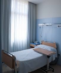 Female doctor visiting patient in hospital room. Single Bed Rooms Are A Must For Future Hospitals Suneel Dhand