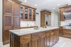 Vanities, granite countertops, quartz, marble and tiles. Elmwood Cabinetry Walnut Cabinets Long Skinny Island Upper Glass Cabinets Stainless Steel Appliances Transitional Kitchen Walnut Cabinets Glass Cabinet