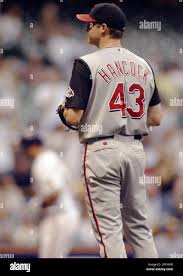 Cincinnati Reds pitcher Josh Hancock, right, looks