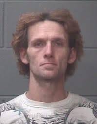 Man held down, attacked with brass knuckles