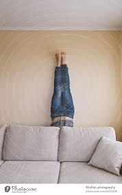Tall double sided green oliva canvas room divider. Man Handstanding Behind The Couch In Yoga A Royalty Free Stock Photo From Photocase