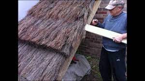 First the thatch is tied in bundles, then laid in an underlayer on the roof beams and pegged in place with rods the art of thatching, fatbadgers. How To Build A Thatch Roof Uk European Style Youtube