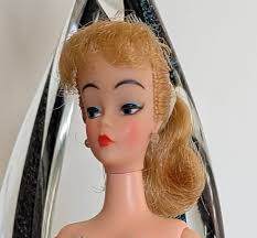 Mitzi doll and vintage outfits