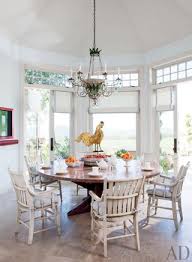The table is distressed markings throughout. 19 Round Dining Tables That Make A Statement Architectural Digest