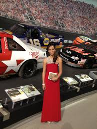 The towering windows of the nascar hall of fame in downtown charlotte, north carolina, were as illuminated as always last night, casting the paved entrance in a bright glow. Cassie Gannis At The Nascar Night Of Champions Gala At Nascar Hall Of Fame Most Popular Driver In The Knwest Series Strapless Dress Formal Model Nascar Racing