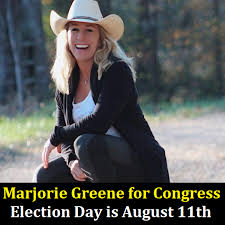 Marjorie taylor greene posted a video of her putting up a sign outside her office saying: Georgia Qanon Supporter Frontrunner In Republican House Primary Us Elections 2020 News Al Jazeera