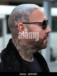Toby Mitchell arrives at the County Court in Melbourne, Thursday, August 9,  2018. Ex-Bandido bikie Toby Mitchell is facing a Community Corrections  Order breach hearing. (AAP Image/David Crosling Stock Photo