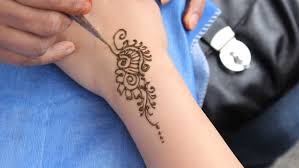 A red henna tattoo illustrated on the wrist, hand, and finger is depicted on left hand of one wearer. An Indian Lady Does A Stock Footage Video 100 Royalty Free 2658515 Shutterstock