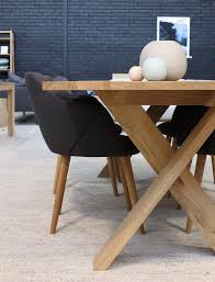 The Unique Design Of The Ethnicraft Pettersson Dining Table Sets This Timeless Piece Apart Featured Here With Dining Table Setting Vase Shop Dining Chairs