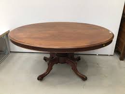 The heavily carved high style drop leaf breakfast table has a top veneered in highly figured crotch mahogany that rests on an apron with a applied molding and a single drawer with a similarly veneered face fitted with an ornately. Lot 132 Victorian Mahogany Breakfast Table With Oval