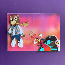 A new pair of nike air force 1s with the kanye west graduation album cover with graduation bear on the outer side of one shoe and the second cover with the murakami artwork on the second shoe. Paper Art Kanye West S Graduation Album Cover On A 4x5 Card Kanyewest