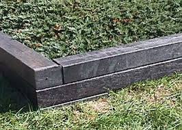 Long Lasting Railroad Ties Are Made Of Recycled Plastic And Used In Place Of Wood Land Railroad Ties Landscaping Landscape Timbers Railroad Tie Retaining Wall
