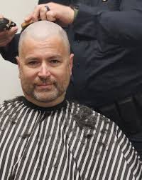 In order to raise awareness of and fund research for childhood cancer,  Sergeant Tom Blake parted ways with his hair this weekend to support the  St. Baldrick's Foundation. Lieutenant Don Patti was