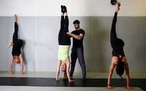 When you go to kick up into a handstand, the first thing you should do (aside from squeezing your butt) is to lock your arms straight by your ears. Why Handstands Are The Ideal Exercise Class Even If Like Me You Re Not Very Good